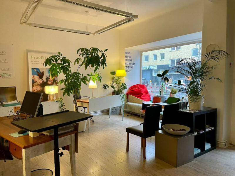 An office room with desks and plants suitable for workshops